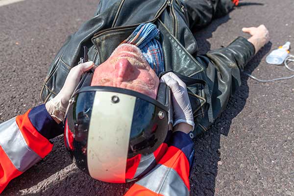 Motorcyclist receiving First Aid after an Accident - First Aid for Motorcyclists Level 2